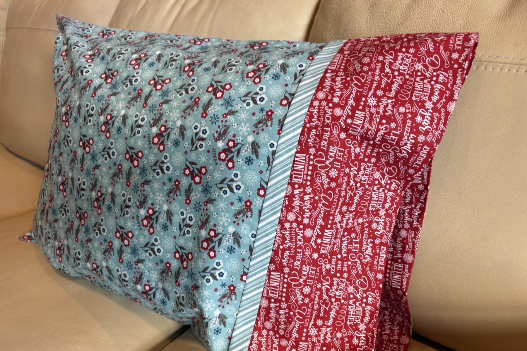 Finished burrito pillowcase with a red cuff and striped flange