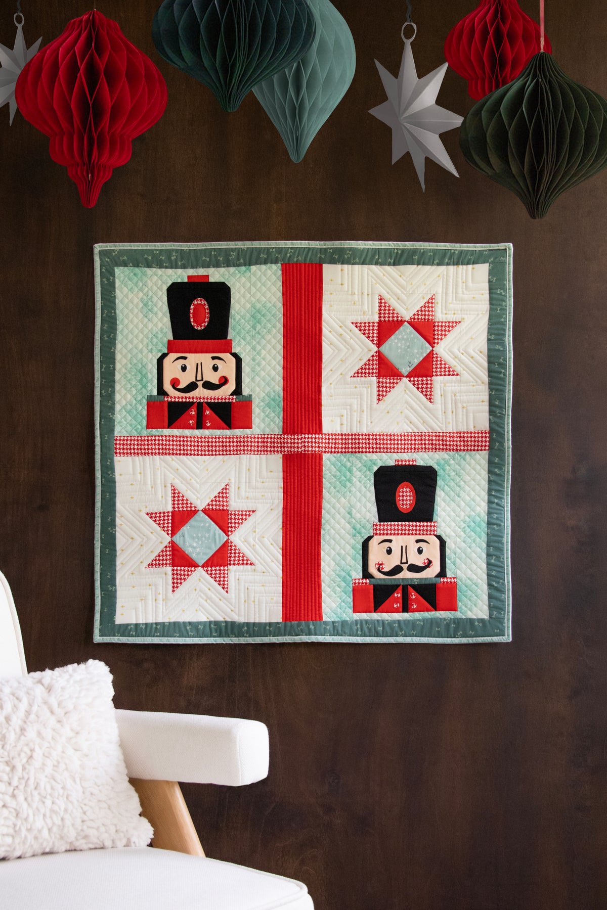 The Nutcracker quilt by AGF Studio for Art Gallery Fabrics: nutcracker blocks, sawtooth stars and evergreen sashing, 30 x 29 inch mini quilt